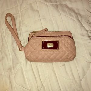 A pink leather Steve Madden wristlet wallet